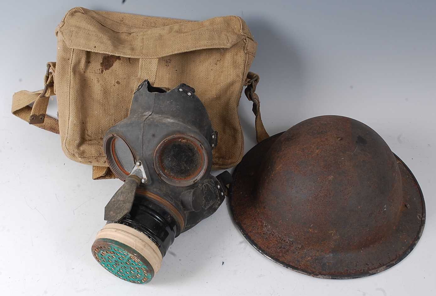 Lot 132 - A WW II Siebe Gorman & Co gas mask, dated 1939...
