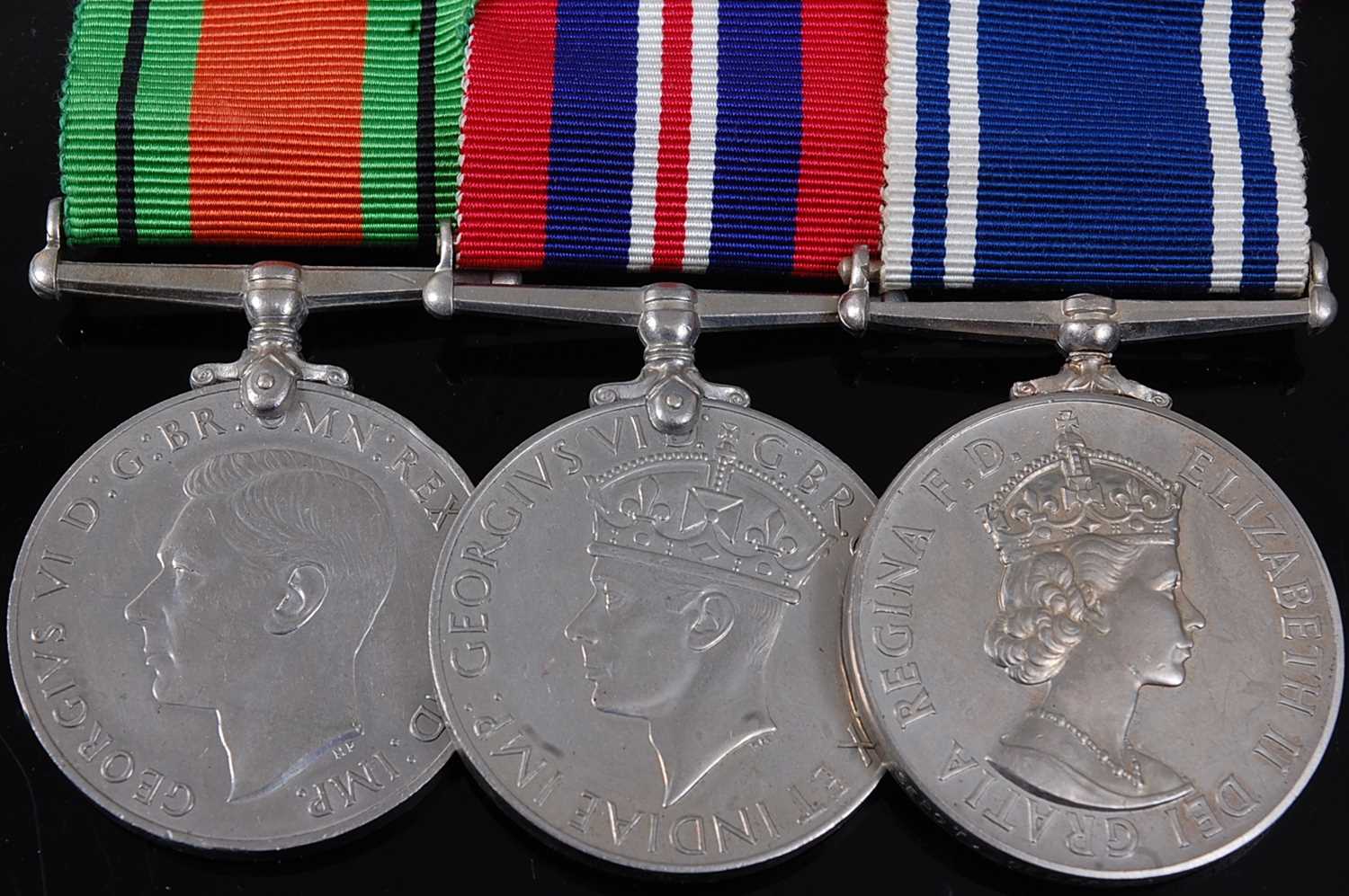 Lot 5 - A group of three medals to include WW II...