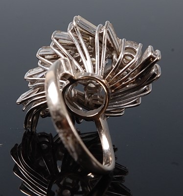 Lot 1219 - A white metal diamond cocktail ring, having...
