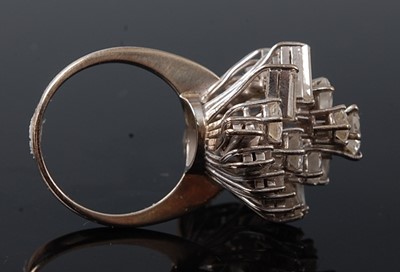 Lot 2227 - A white metal diamond cocktail ring, having...