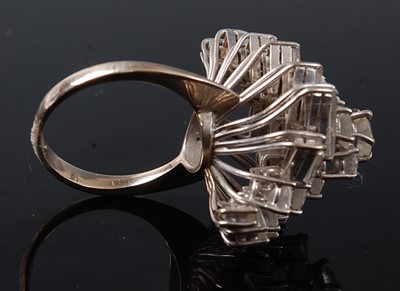Lot 1219 - A white metal diamond cocktail ring, having...
