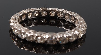 Lot 2237 - A white metal diamond full hoop eternity ring,...