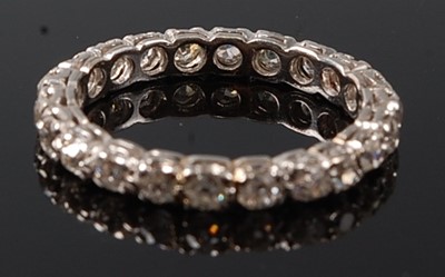 Lot 2237 - A white metal diamond full hoop eternity ring,...