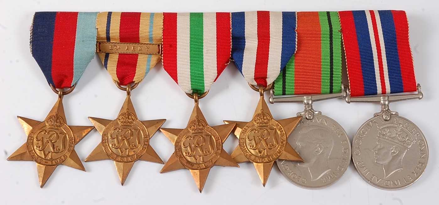 Lot 30 - A group of six WW II medals to include...