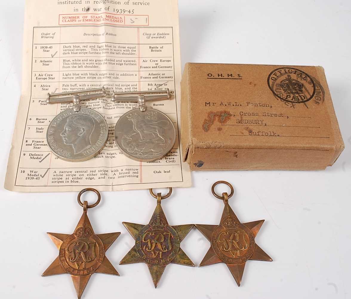 Lot 31 - A group of five WW II medals, to include...