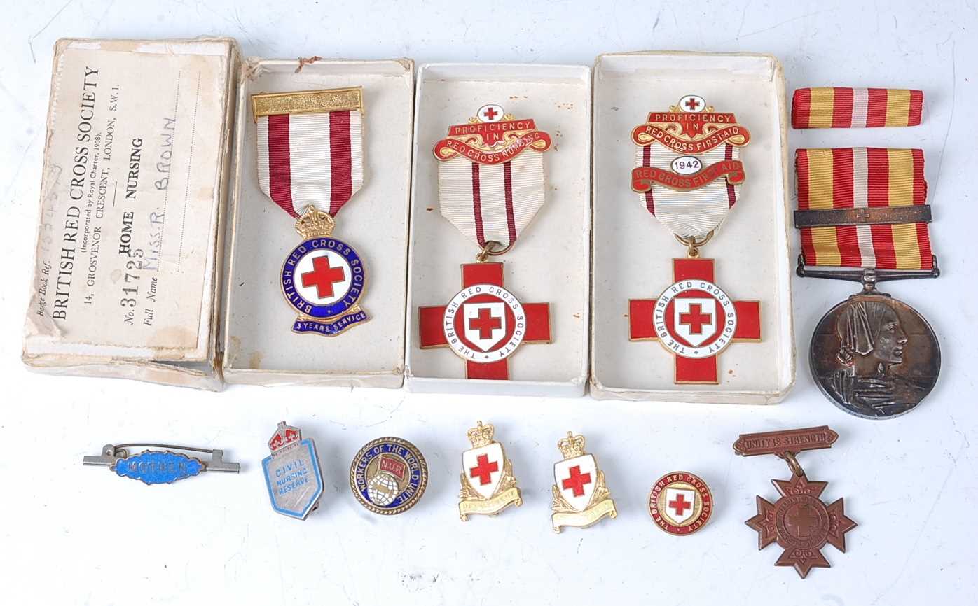 Lot 38 - A British Red Cross Society enamelled breast...