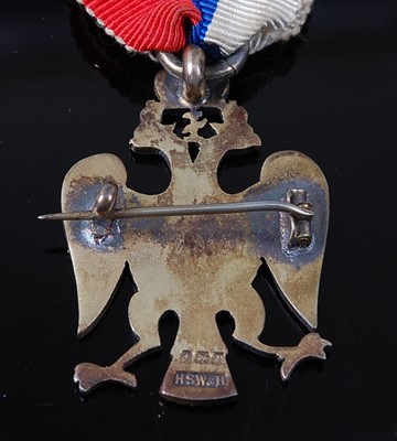 Lot 43 - An English made silver and enamelled badge for...