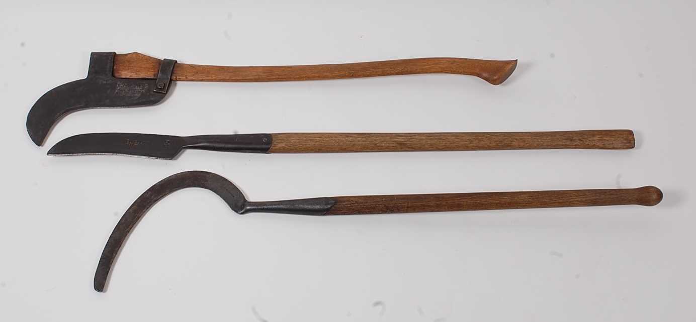 Lot 389 - * An early model bush brush axe, the blade