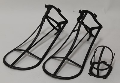 Lot 412 - * A pair of iron saddle racks, each with tack...