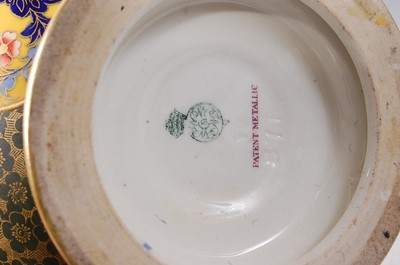 Lot 2039 - A Royal Worcester porcelain twin handled...