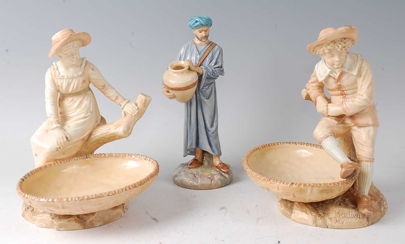 Lot 2041 - A pair of Royal Worcester figural comports by...