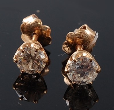 Lot 2249 - A pair of yellow metal diamond single stone...