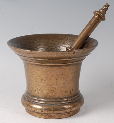 Lot 2347 - An 18th century bronze pestle and mortar, the...