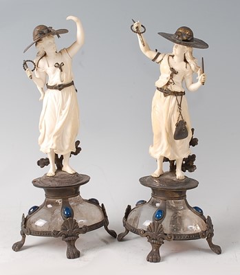 Lot 2351 - A pair of continental carved ivory table...