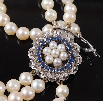 Lot 2253 - A three-row pearl necklet, comprising three...