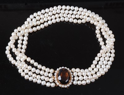 Lot 2251 - A four-row pearl choker, featuring four rows...