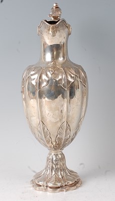 Lot 2134 - A Victorian silver claret jug, the lobed body...