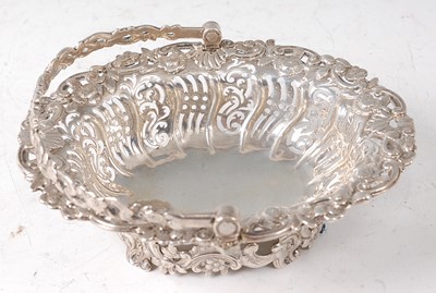 Lot 2133 - A George II silver sweetmeat basket, of shaped...