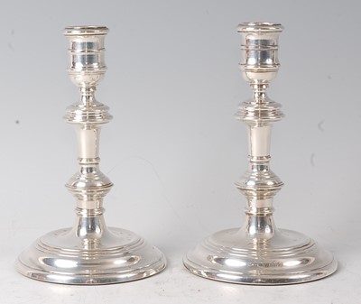 Lot 2137 - A pair of silver candlesticks, in the mid-18th...