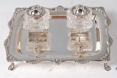 Lot 2139 - An Edwardian silver desk stand, of shaped...