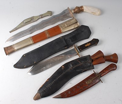 Lot 180 - An Indian Kukri having a typical curved blade...