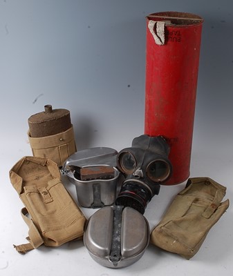 Lot 181 - A WW II British civilian gas mask, dated 1940,...