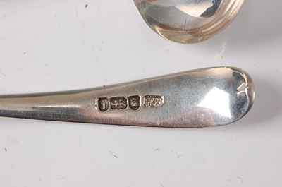 Lot 2183 - A pair of George III silver sauce ladles, in...