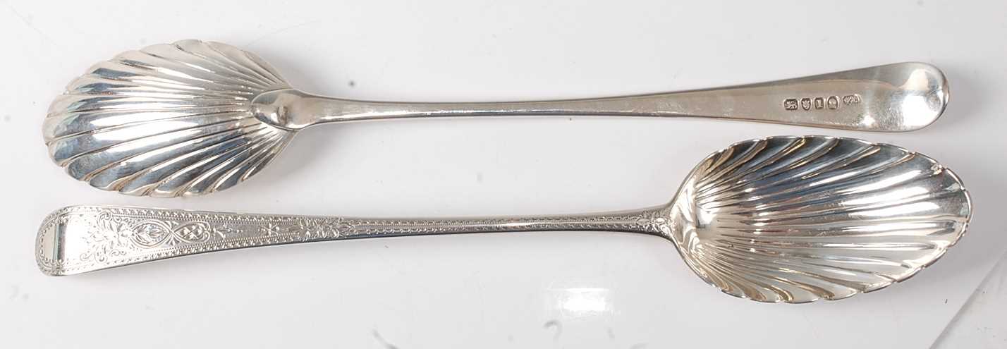 Lot 2192 - A pair of George III silver serving spoons, in...