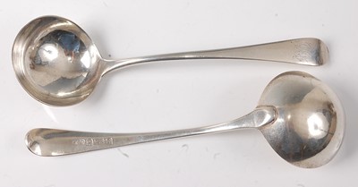 Lot 2194 - A pair of George III silver sauce ladles, in...