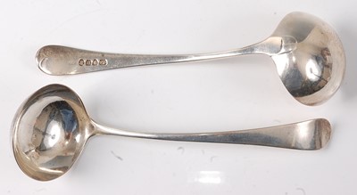 Lot 2195 - A pair of George III silver sauce ladles, in...