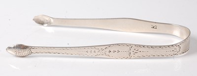 Lot 2197 - A pair of George III silver sugar bows, each...