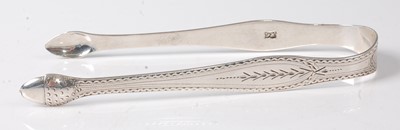 Lot 2198 - A pair of George III silver sugar tongs,...
