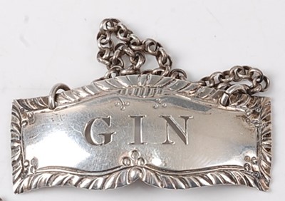 Lot 2179 - A George III silver decanter label for Gin,...