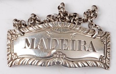 Lot 2180 - A George III silver decanter label for Madeira,...