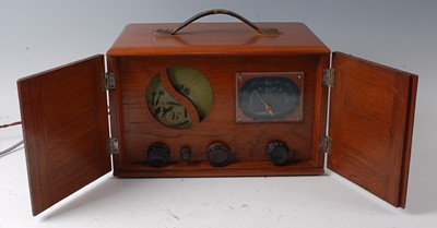Lot 187 - WITHDRAWN A walnut cased Eveready radio, in a...