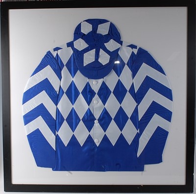 Lot 314 - A framed set of jockey silks in blue and white...