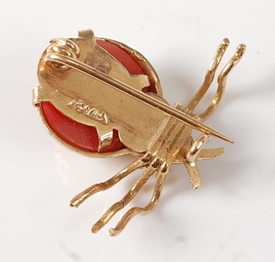 Lot 2255 - A yellow metal coral beetle brooch, comprising...