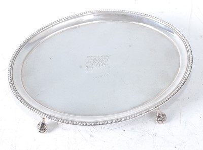Lot 2178 - A George III silver teapot stand. of beaded...