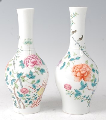 Lot 2371 - A pair of Chinese famille rose bottle vases,...