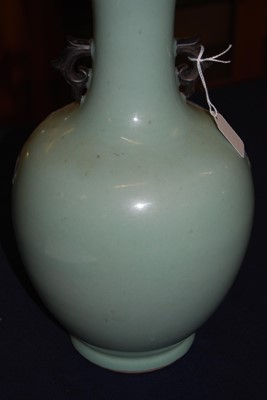Lot 45 - A Chinese export celadon ground baluster vase,...
