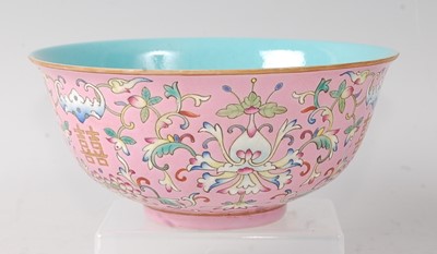 Lot 2377 - A Chinese porcelain pink ground bowl, enamel...