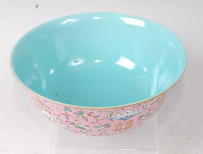 Lot 154 - A Chinese porcelain pink ground bowl, enamel...