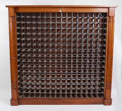 Lot 1424 - A contemporary oak wine rack, with the...