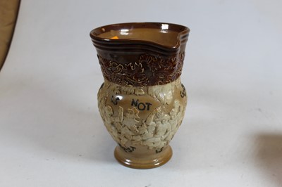 Lot 65 - A Doulton Lambeth stoneware jug, with bucolic...