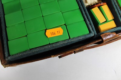 Lot 92 - A 20th century plastic mah jong set, housed in...