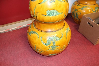 Lot 133 - A pair of Chinese double gourd floor vases,...