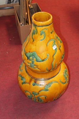 Lot 133 - A pair of Chinese double gourd floor vases,...