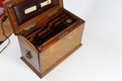 Lot 112 - An early 20th century oak stationery box, the...