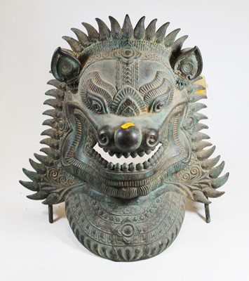 Lot 214 - An eastern verdigris metal zoomorphic mask,...