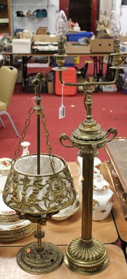 Lot 154 - A brass twin light table lamp, surmounted by a...